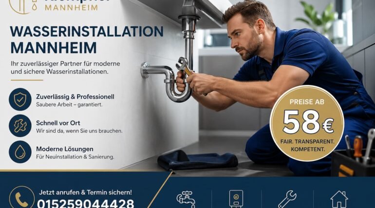 Plumber repairing a water pipe under a sink in a modern home setting